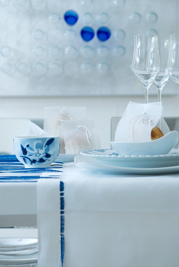 Festive place setting in white and blue