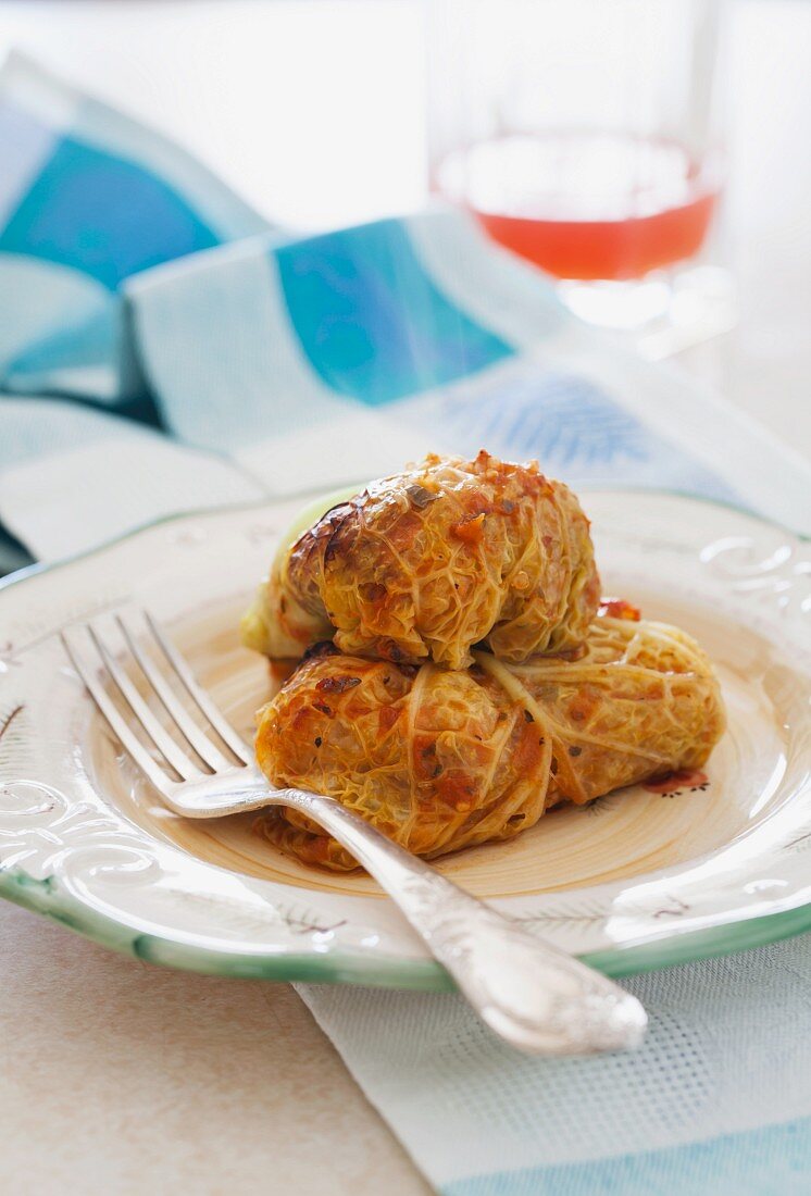 Vegetarian stuffed cabbage rolls with quinoa, onions & carrots (gluten and dairy free)