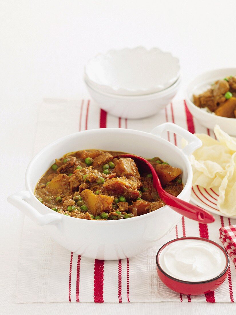 Hähnchencurry mit Kürbis und Erbsen