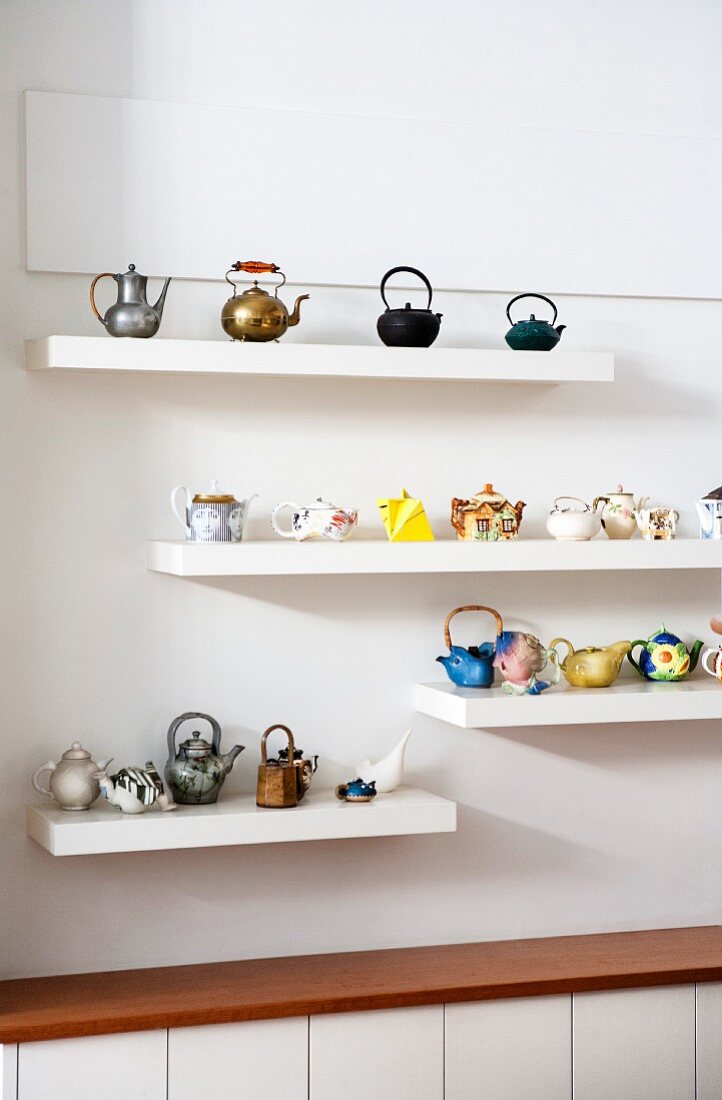Collections of teapots on floating shelves