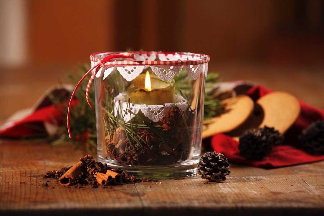 Hand-crafted candle lantern with festive spices