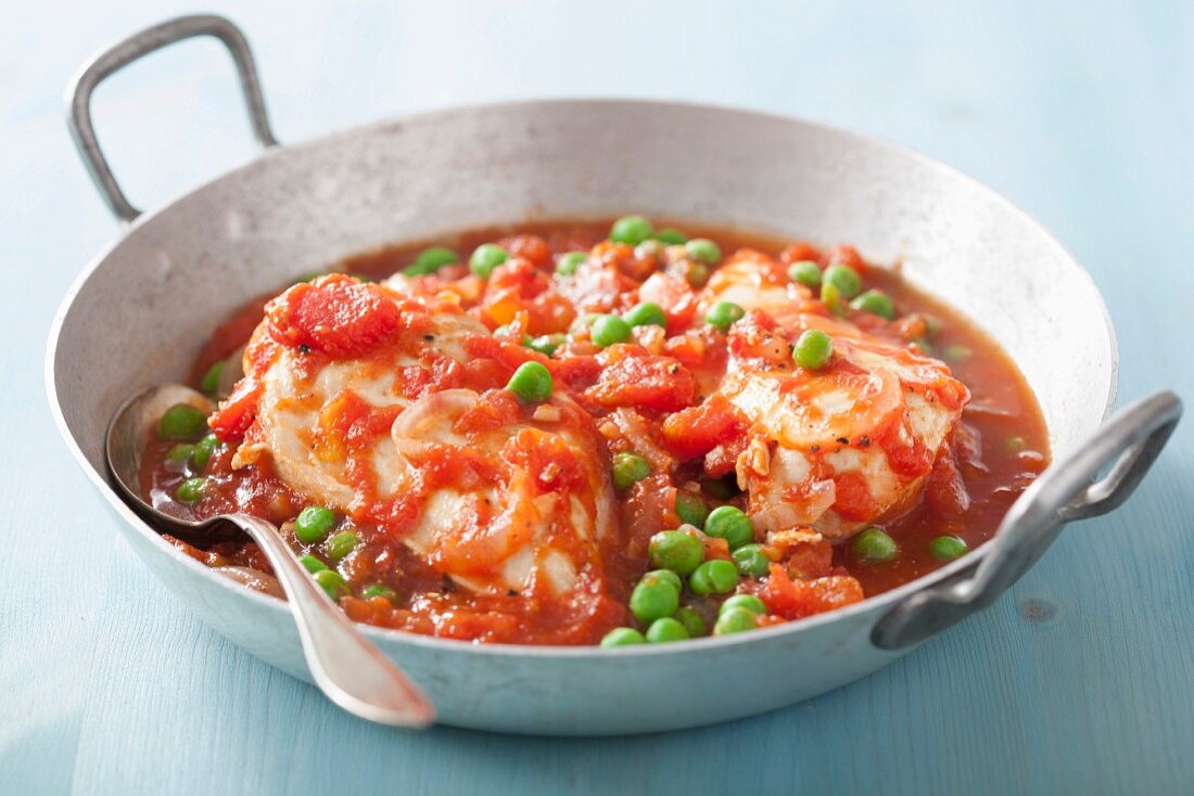 Chicken breast in tomato sauce with peas