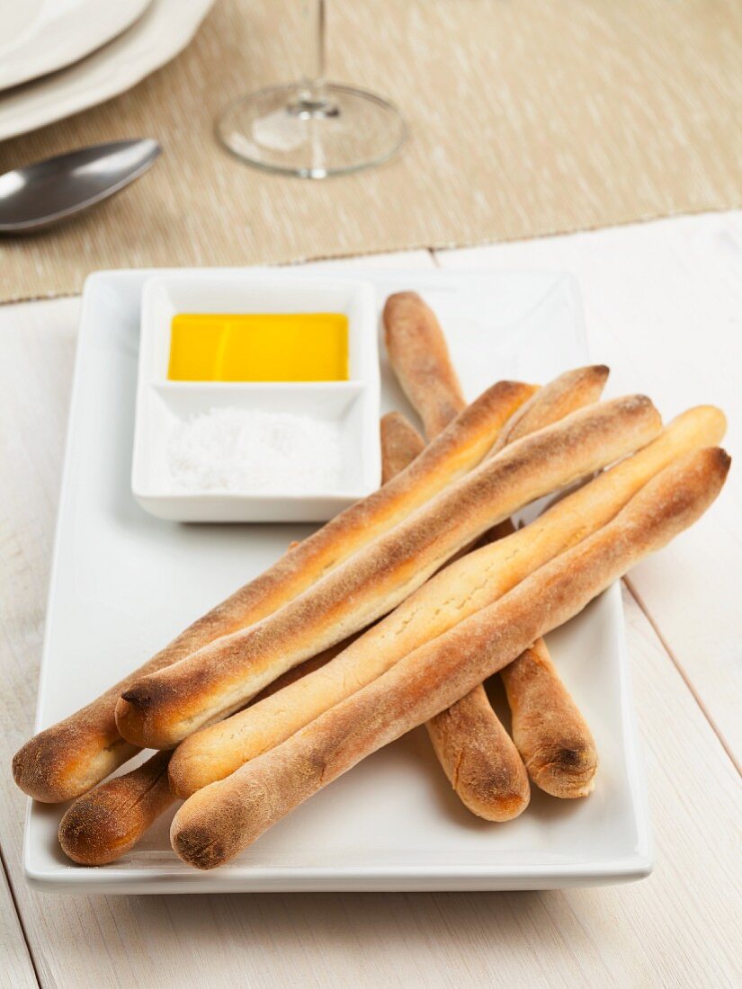 Home-made grissini (Italian breadsticks) with olive oil and sea salt