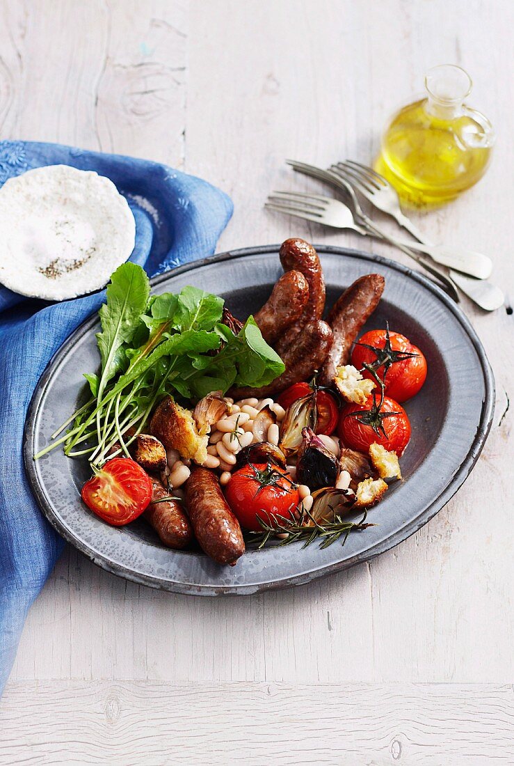 Sausages with beans and grilled tomatoes