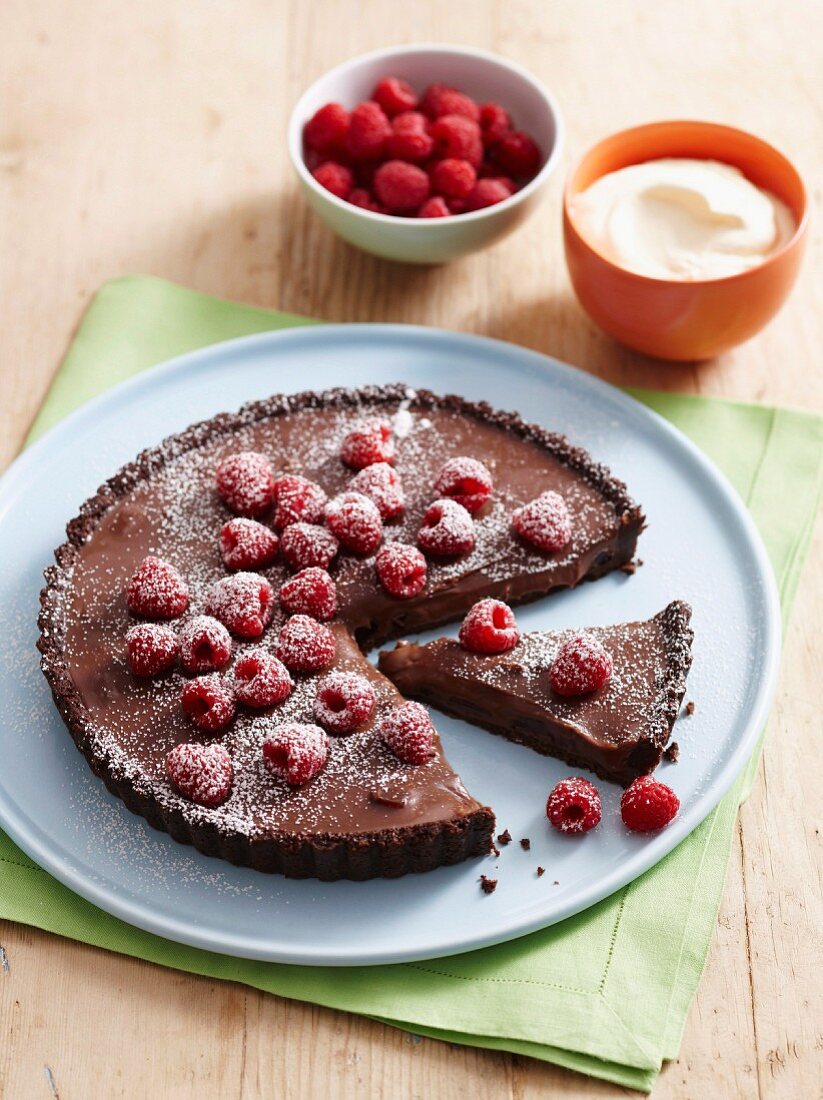 A chocolate tart with rosewater and raspberries