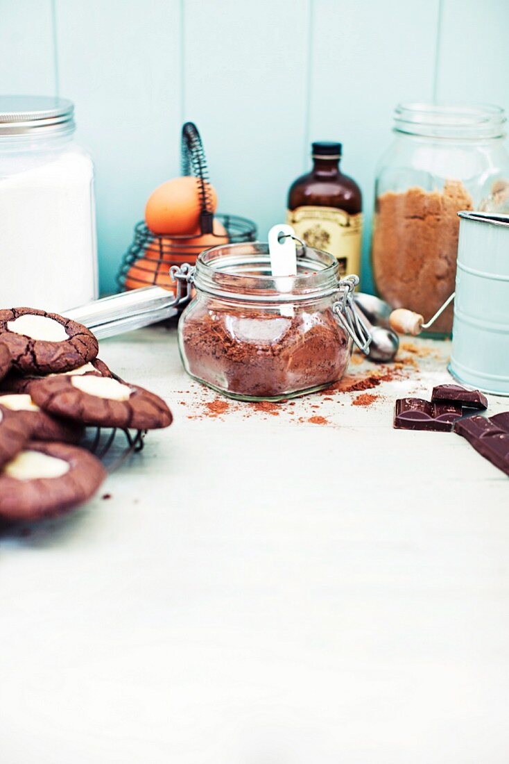 An arrangement of baking ingredients and chocolate cream cheese biscuits
