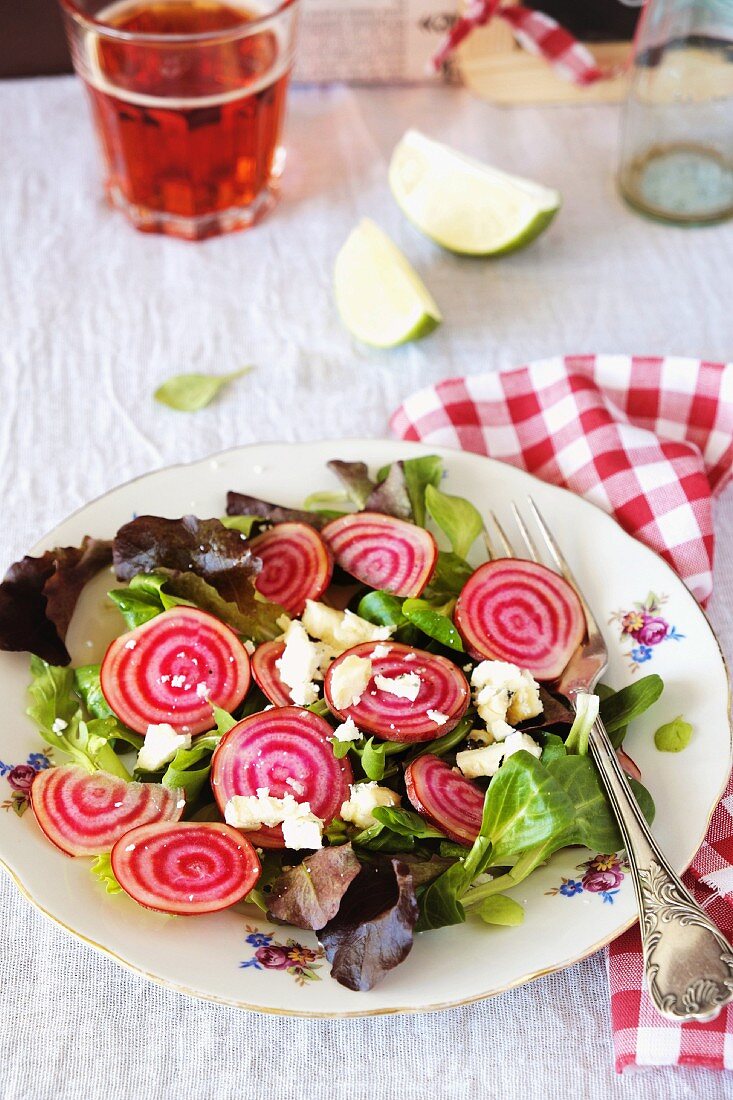 A mixed leaf salad with beetroot and feta cheese