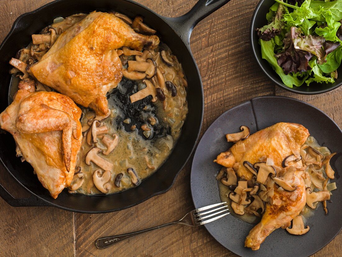 Chicken quarters with mushroom sauce and a mixed leaf salad