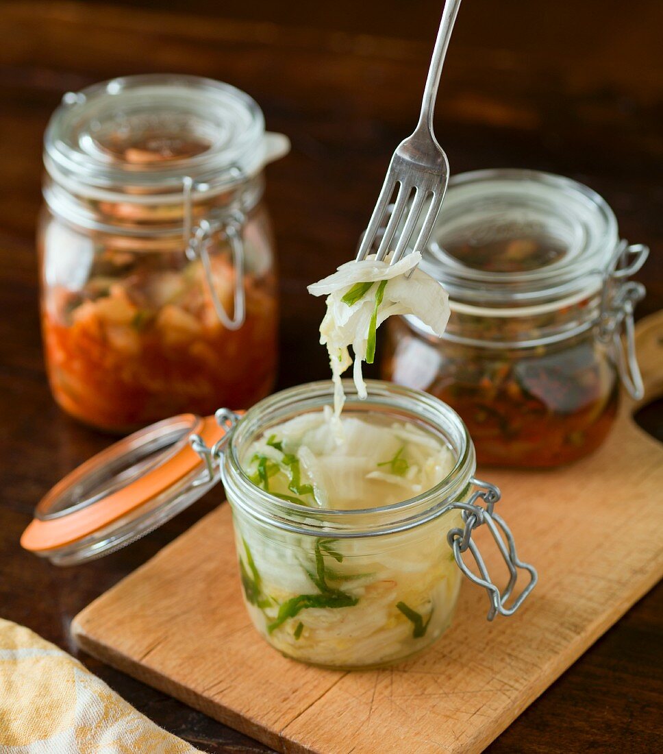Three types of kimchi in jars