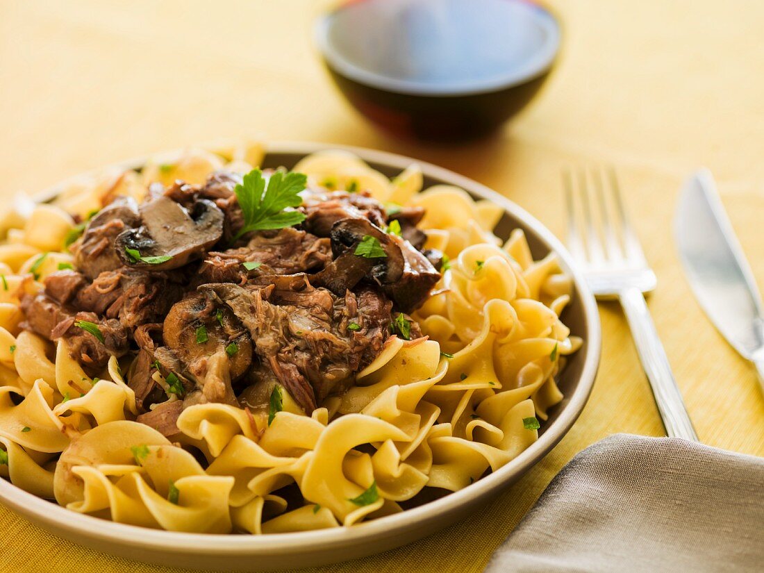 Egg noodles with mushrooms and an ox tail sauce