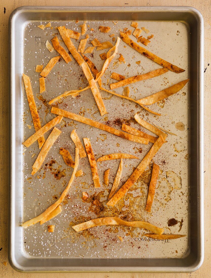 Tortilla strips on a baking tray