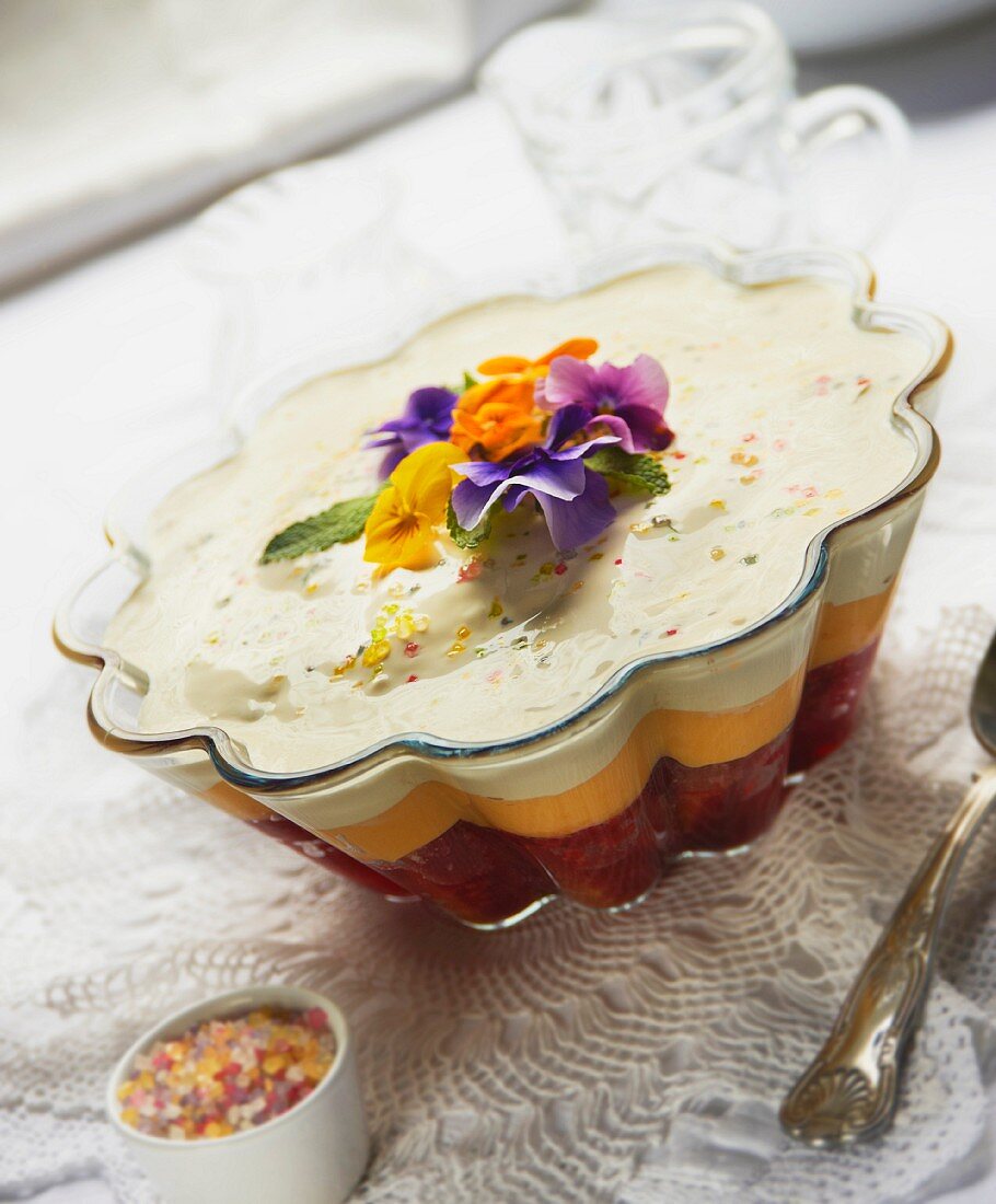 A sherry trifle with edible flowers