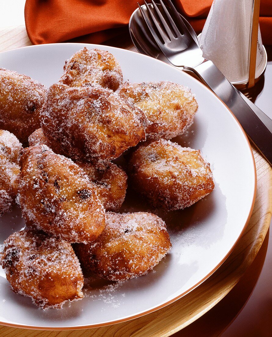 Small raisin doughnuts sprinkled with sugar