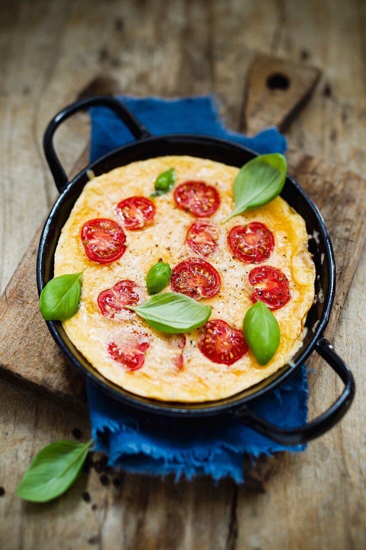 A tomato omelette with fresh basil