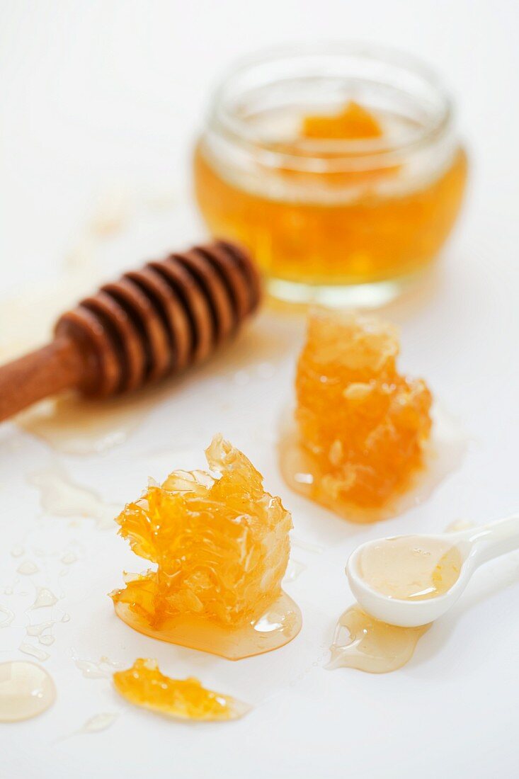 Honey and honeycomb with a honey spoon