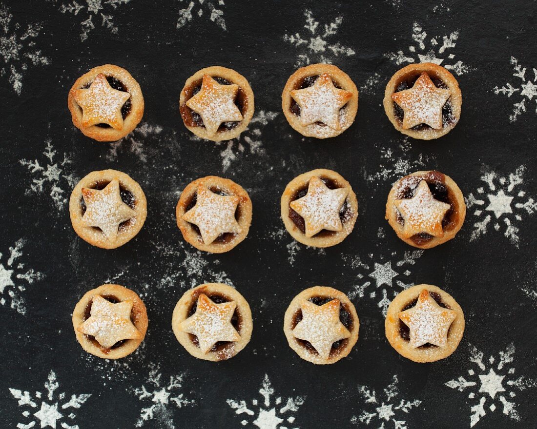 Mini mince pies topped with a star and dusted with icing sugar