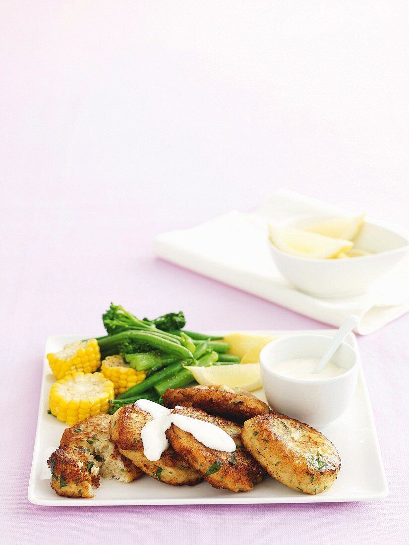 Crab cakes with vegetables and aioli