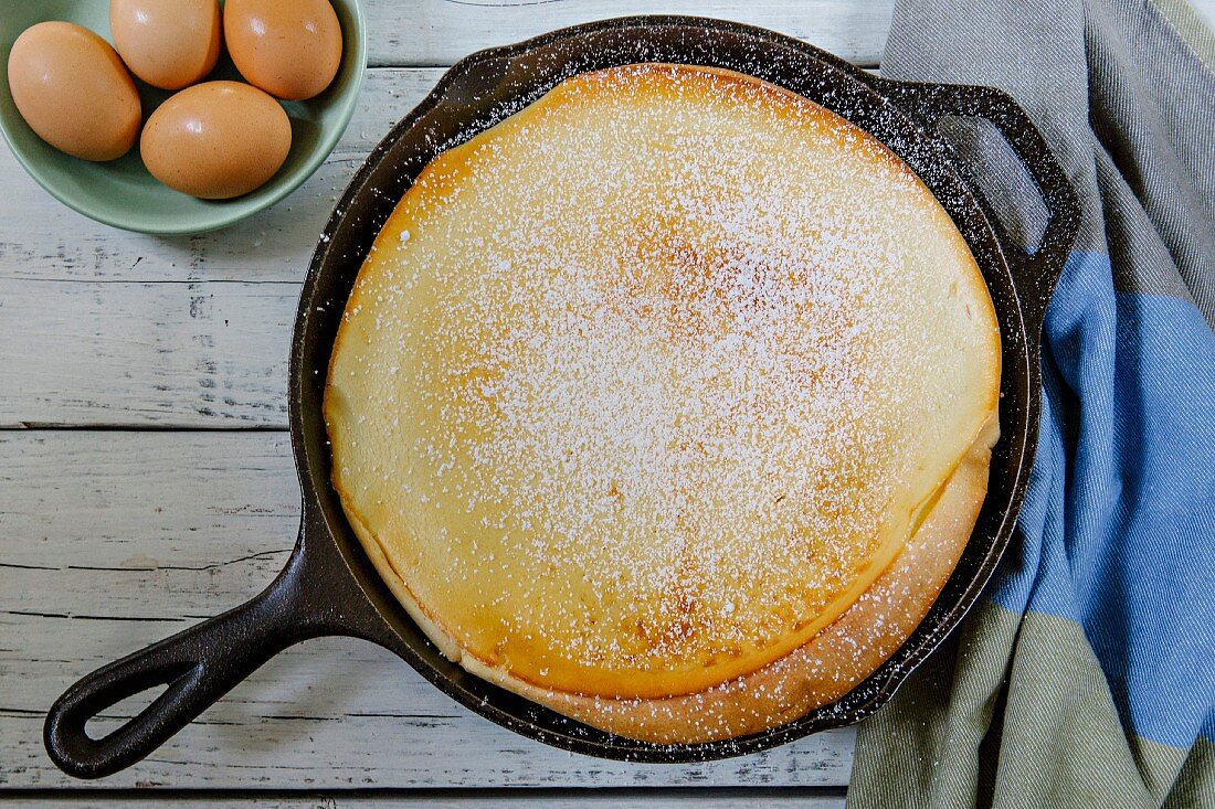 A Dutch pancake dusted with icing sugar