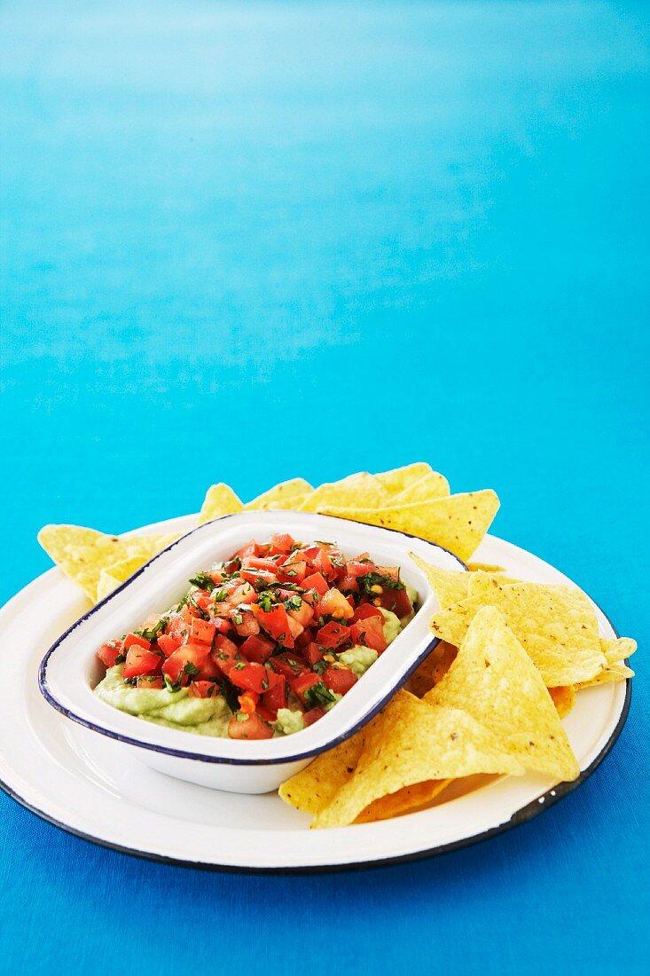 Tacos with an avocado dip and tomato salsa