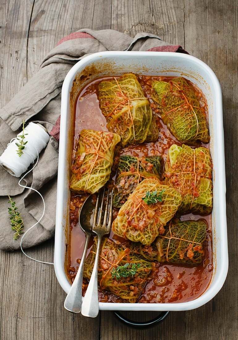 Savoy cabbage parcels with a minced meat filling and tomato sauce