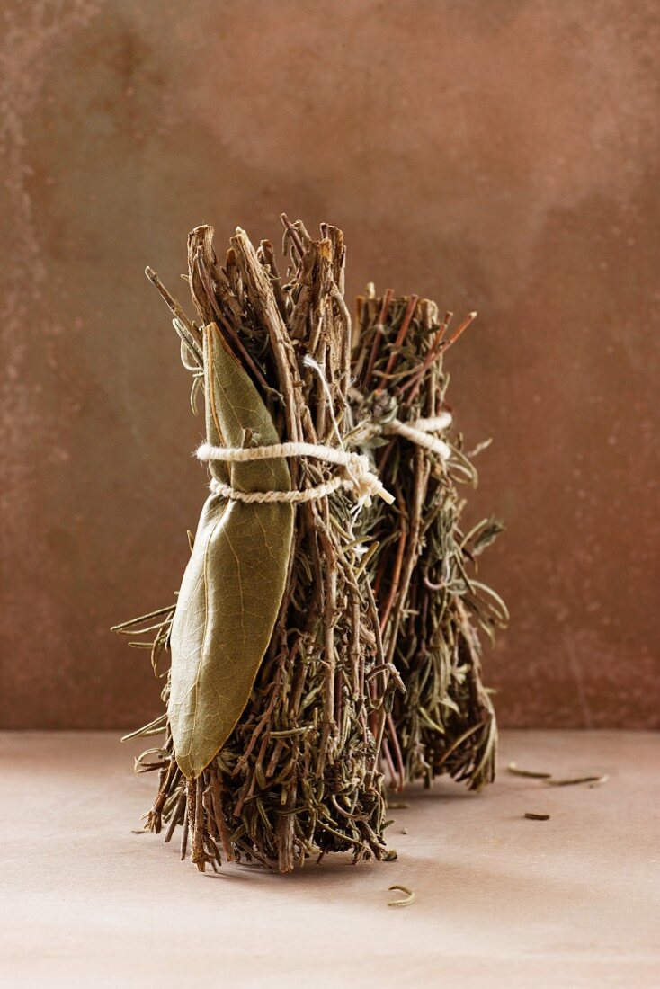 Dried bunches of herbs with thyme, bay leaves, rosemary and oregano