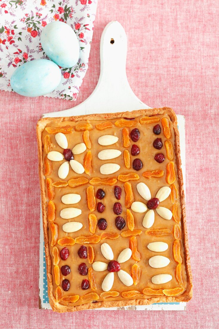 Mazurek (Easter cake, Poland) with caramel, almonds and cranberries