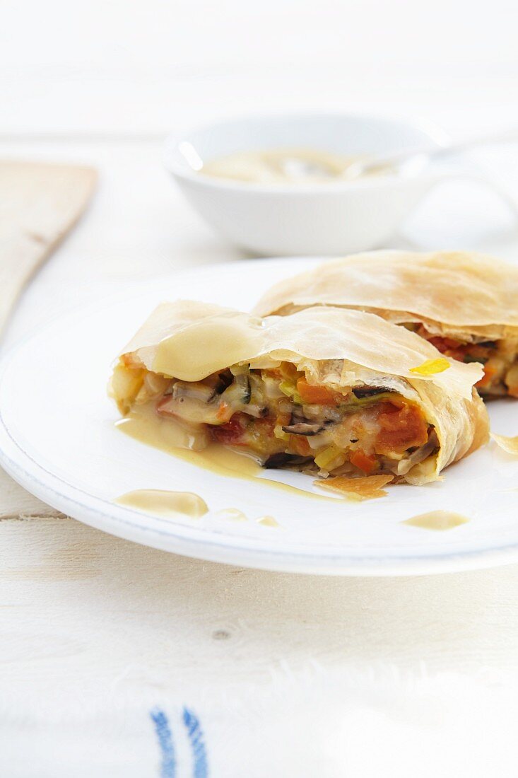 Vegetable strudel with sauce