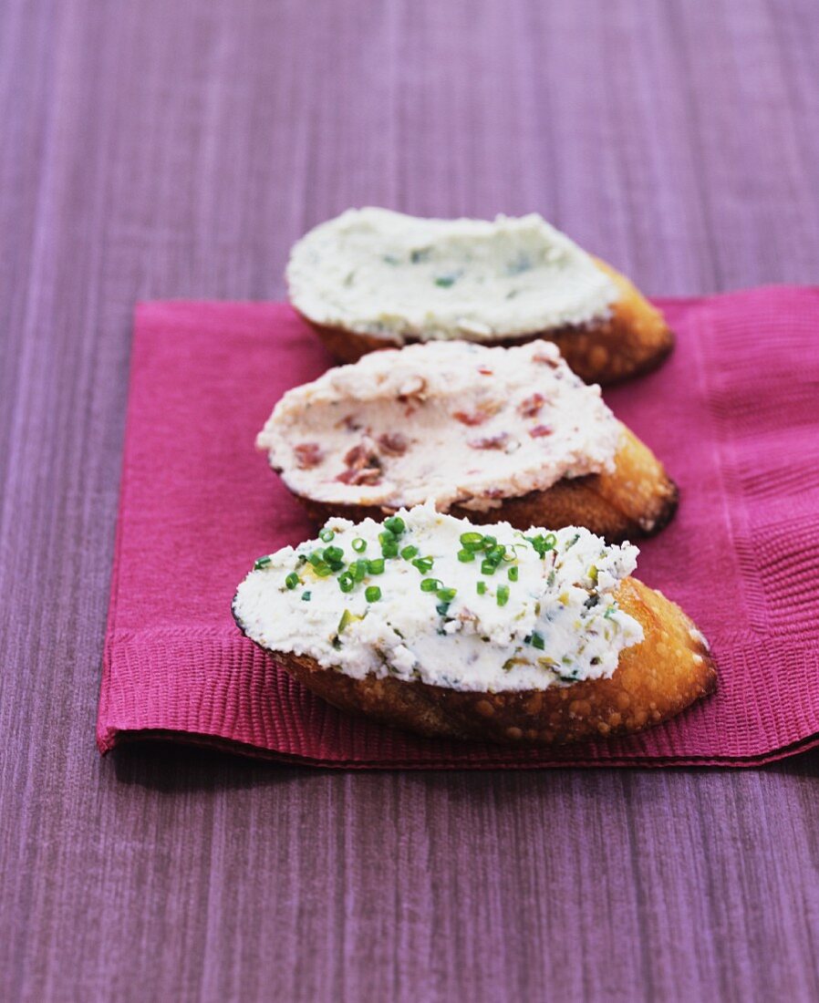 Three slices of bread with goats cheese spreads