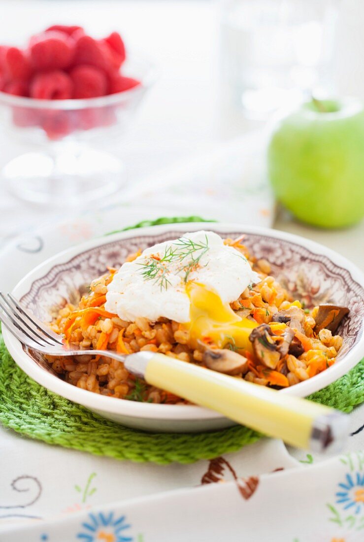 Farro with mushrooms, carrot and poached egg