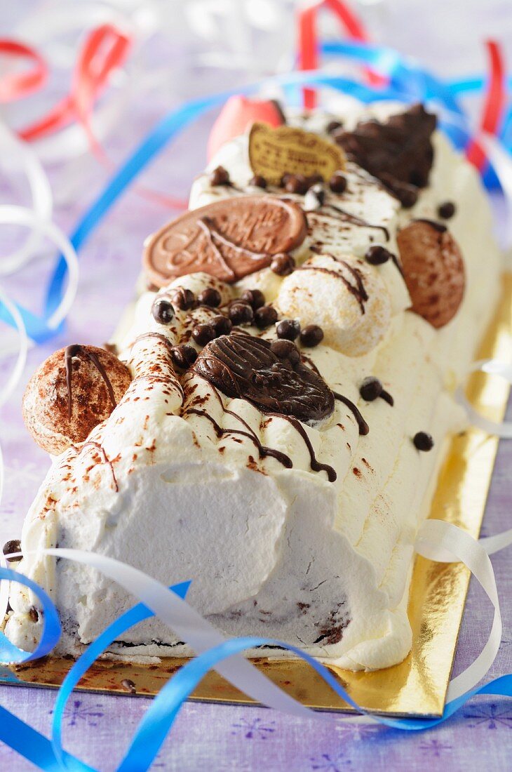 A Swiss roll decorated with streamers for New Year's Eve