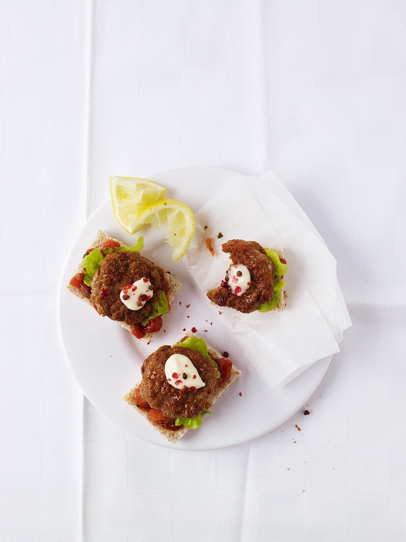 Crisp bread topped with mini meatballs