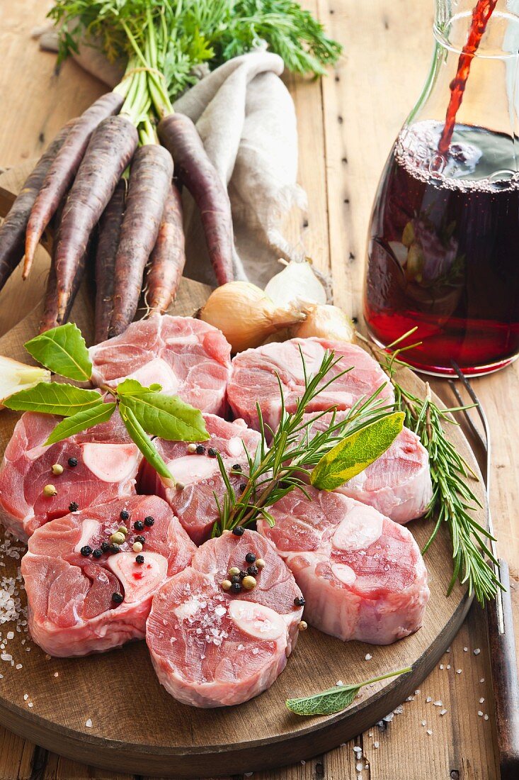 Raw calf's legs slices with herbs and spices