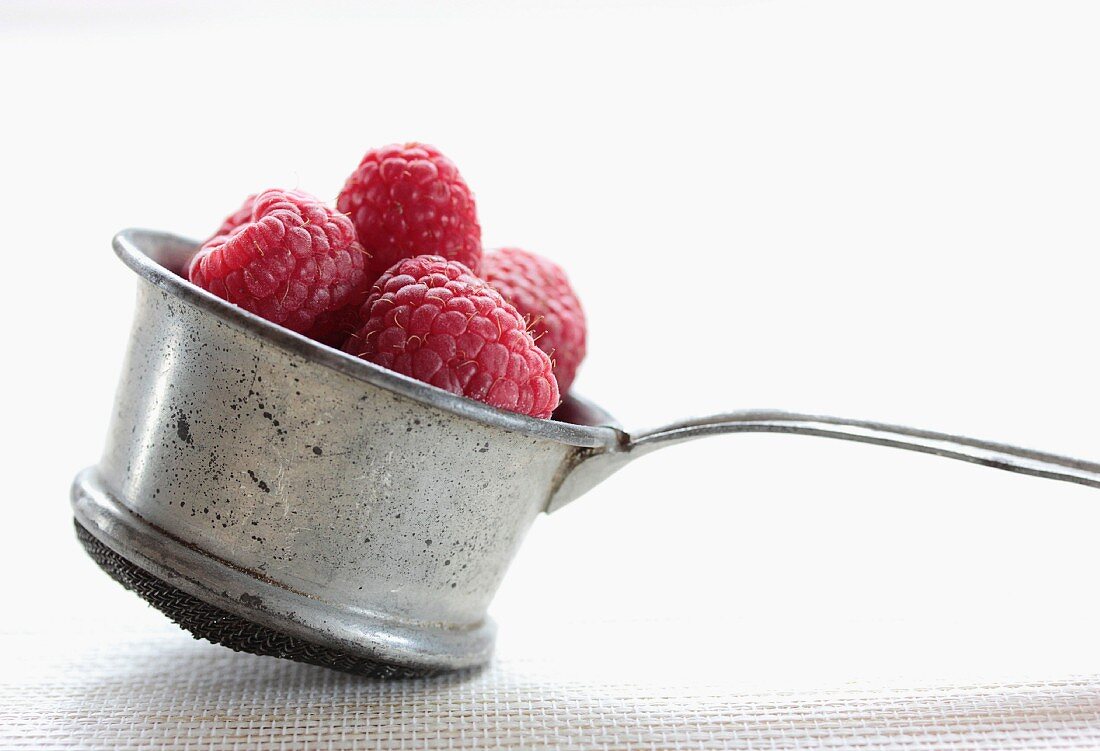 Raspberries in an old-fashioned sieve