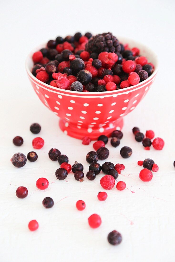 Frozen mixed berries in a spotted bowl