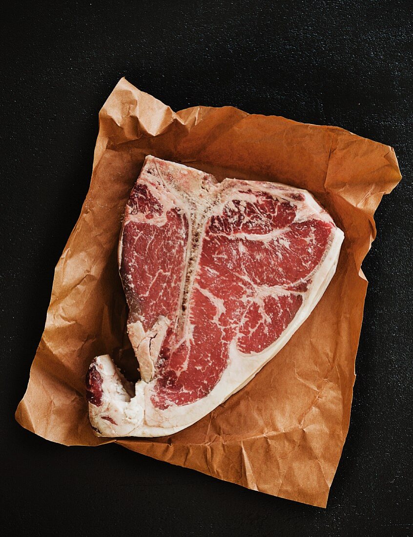 Porterhouse steak on a piece of paper