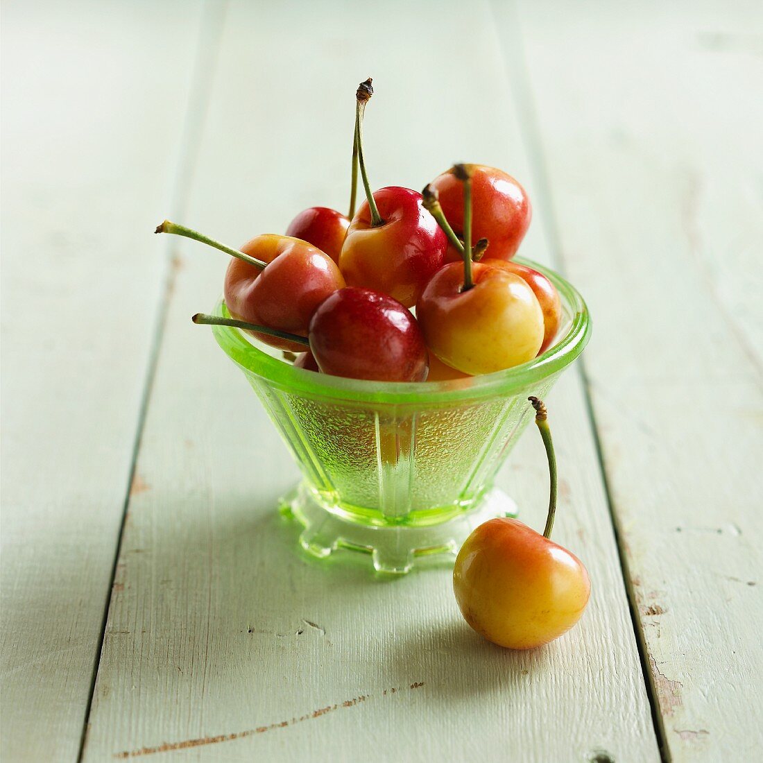 Fresh sweet cherries in a glass bowl