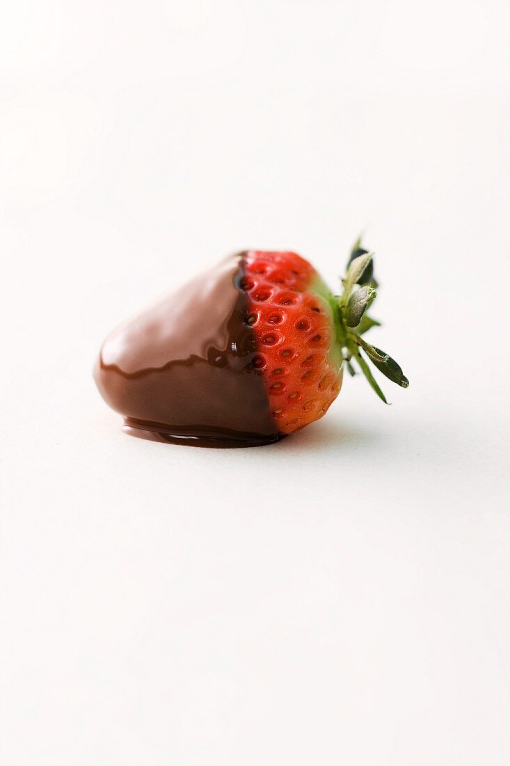 A strawberry dipped in dark chocolate