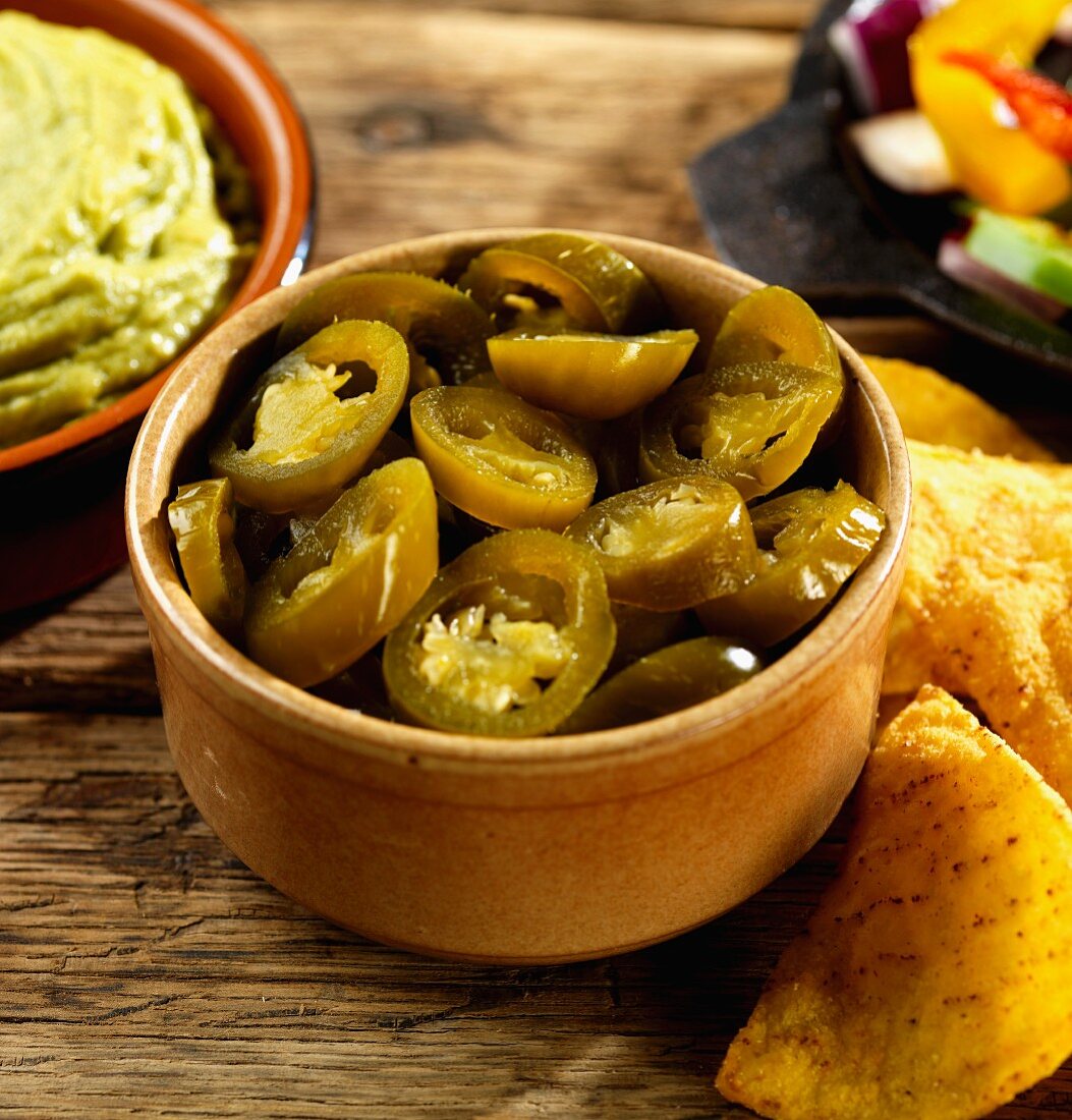 Pickled jalapeños, guacamole and tortilla chips (Mexico)