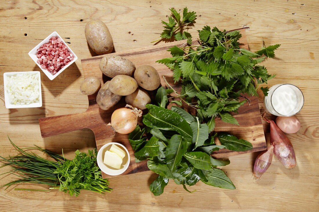 Ingredients for making potato cakes with stinging nettles and spinach