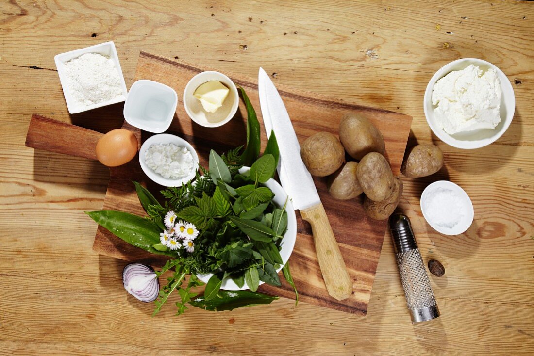 Ingredients for making potato doughnuts with a wild herb dip