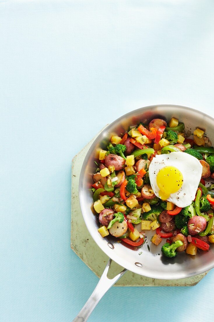 Vegetable hash with a fried egg