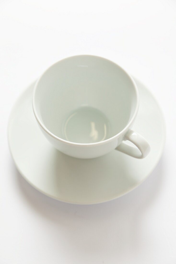 A white cup and saucer