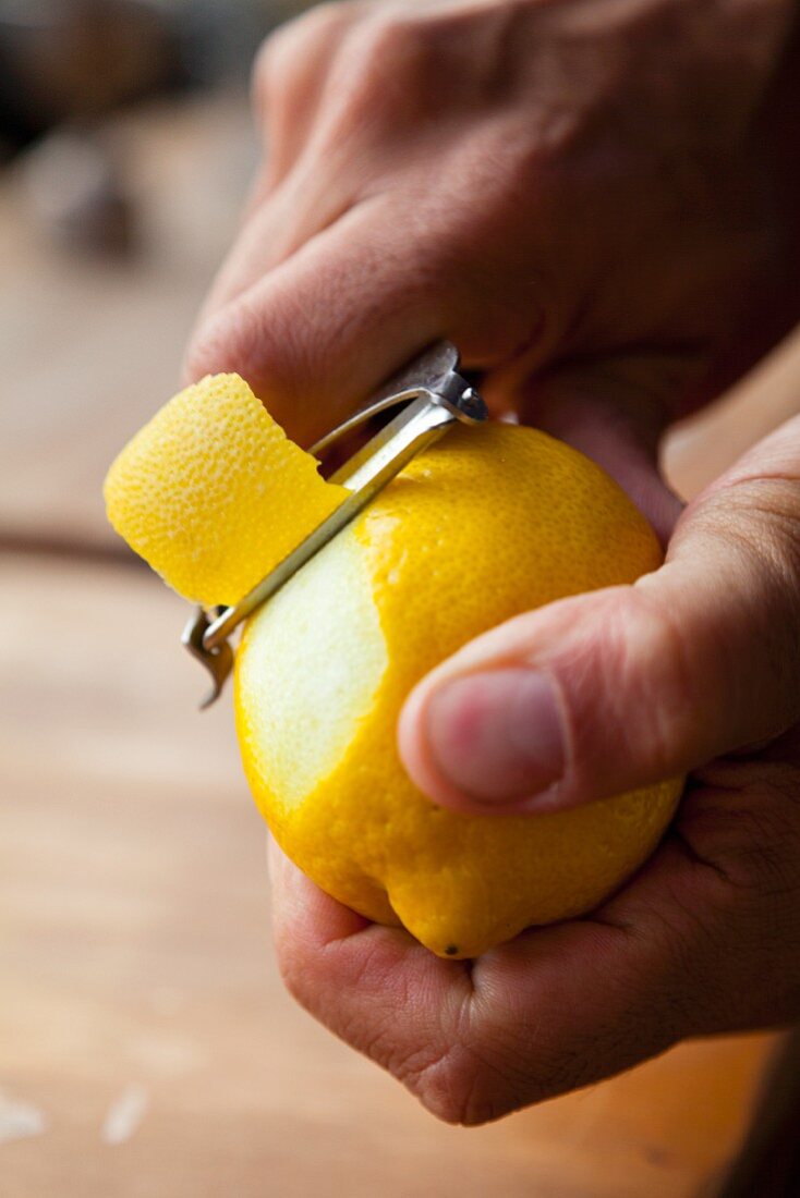 A lemon being peeled