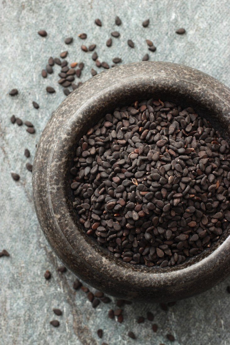 Black sesame seeds in a mortar