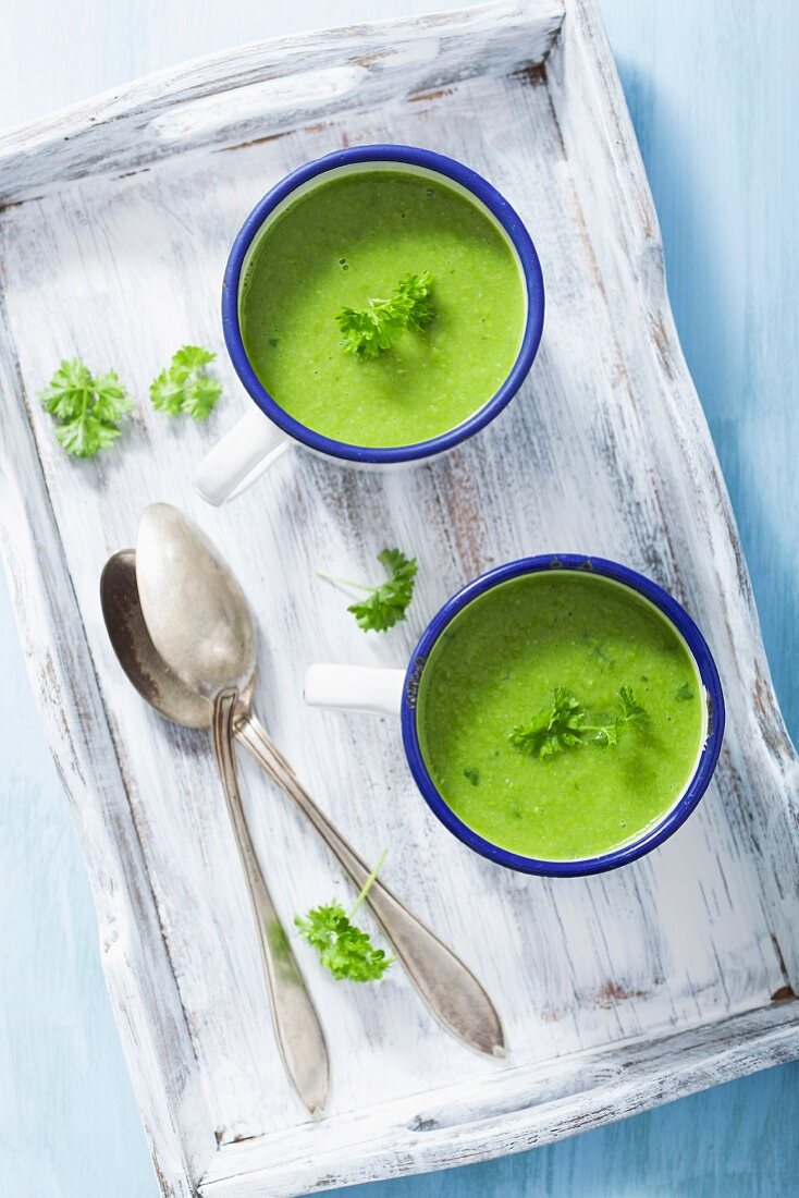 Cream of pea soup garnished with parsley