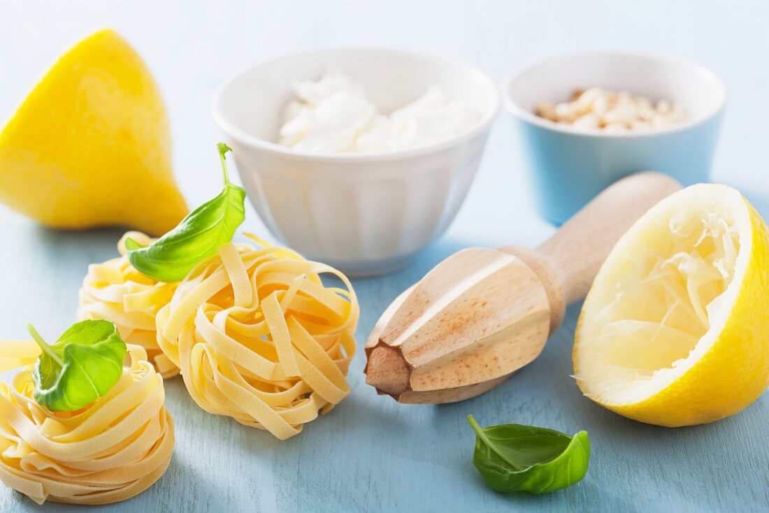 Ingredients for making tagliatelle with feta, lemon and basil