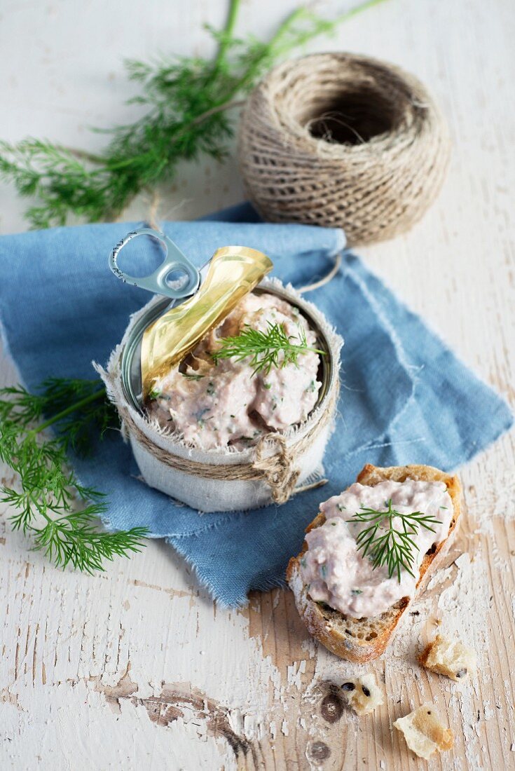 Tuna rillette on bread and in a jar