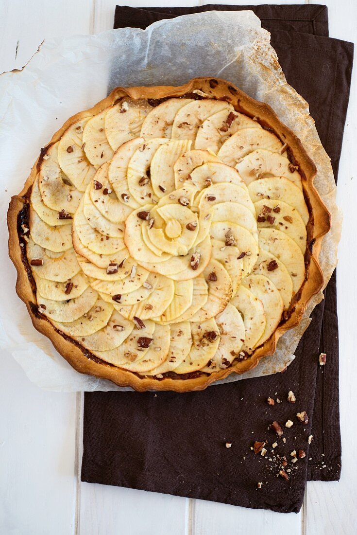 An apple tart with dulce de leche and pecan nuts