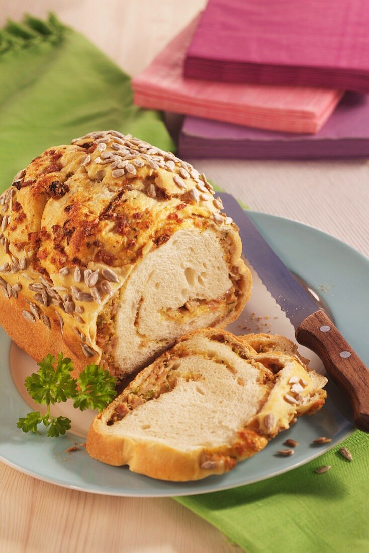 A bread roulade filled with ham, sliced