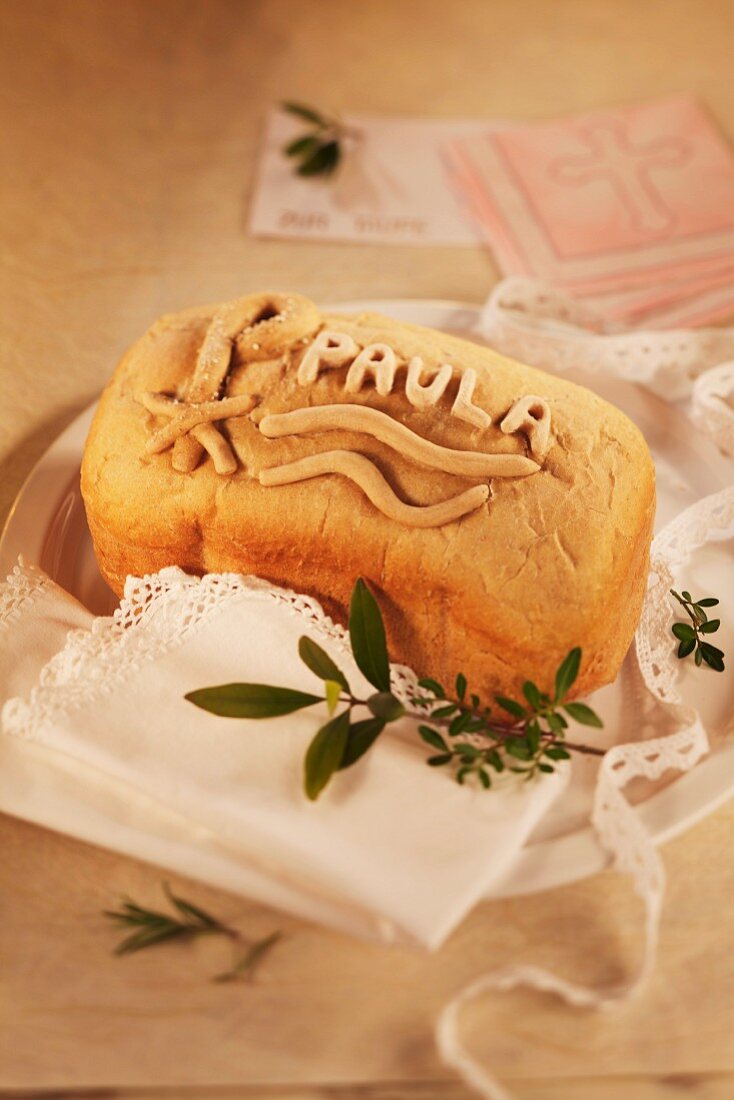 A loaf of bread for a Christening decorated with a name